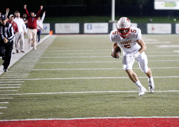 Cardinal Mooney's Nico Marchionda runs toward the endzone to score a touchdown during the first half of their game against Ursuline at Stambaugh Studium on Friday. EMILY MATTHEWS | THE VINDICATOR