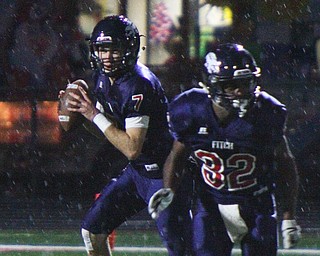 William D. Lewis The Vindicator  Fitch QB Bobby cavalier(7) looks down field as RoddellBebbs(32) blocks during 10-19-18 game with Boardman at Fitch.