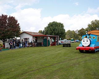 A Thomas the Tank Engine train ride, designed, built, and operated by Eugene Eliser, drives up for kids to get on at Parto's Golf Learning Center's annual children's Halloween party on Saturday. EMILY MATTHEWS | THE VINDICATOR