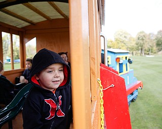 Corbin Salensky, 5, of Struthers, rides a Thomas the Tank Engine train ride at Parto's Golf Learning Center's annual children's Halloween party on Saturday. EMILY MATTHEWS | THE VINDICATOR