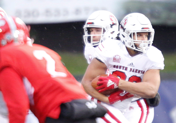 South Dakota's Ben Klett runs with the ball during the first half of their game against Youngstown State at Stambaugh Stadium on Saturday. EMILY MATTHEWS | THE VINDICATOR