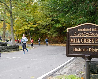 People run through Mill Creek Park during the Youngstown Peace Race 10K on Sunday morning. EMILY MATTHEWS | THE VINDICATOR