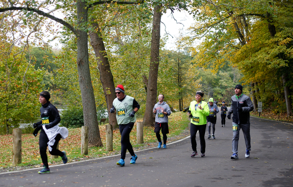 People run through Mill Creek Park during the Youngstown Peace Race 10K on Sunday morning. EMILY MATTHEWS | THE VINDICATOR