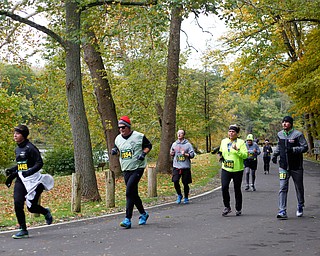 People run through Mill Creek Park during the Youngstown Peace Race 10K on Sunday morning. EMILY MATTHEWS | THE VINDICATOR