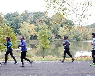 Race participants run past Lake Glacier during the Youngstown Peace Race 10K on Sunday morning. EMILY MATTHEWS | THE VINDICATOR