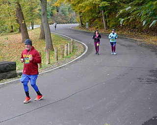 Dan Horacek, of Youngstown, runs through Mill Creek Park during the Youngstown Peace Race 10K on Sunday morning. EMILY MATTHEWS | THE VINDICATOR