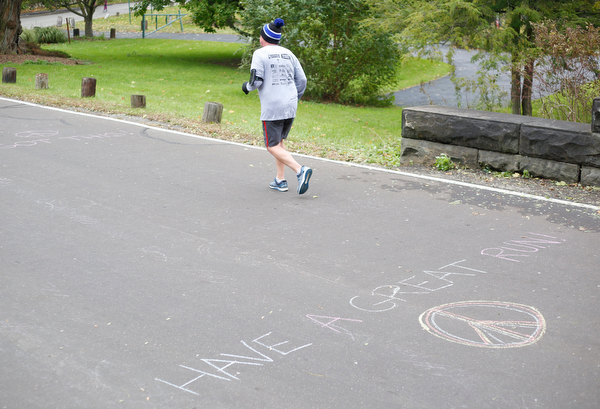 Donald Jones, of Warren, runs through Mill Creek Park during the Youngstown Peace Race 10K on Sunday morning. EMILY MATTHEWS | THE VINDICATOR