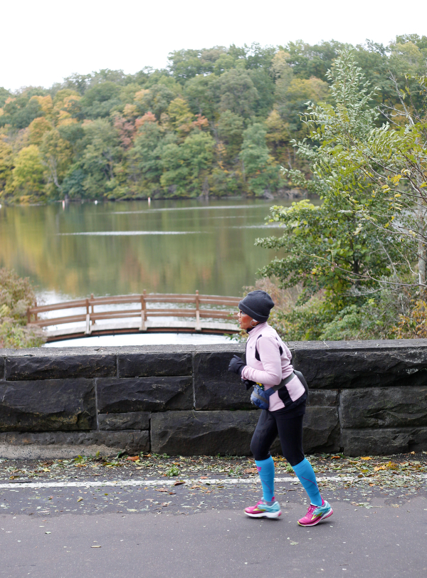 Virginia Banks, of Youngstown, runs past Lake Glacier during the Youngstown Peace Race 10K on Sunday morning. EMILY MATTHEWS | THE VINDICATOR