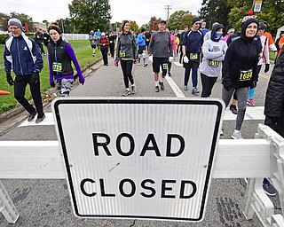 YOUNGTSOWN, OHIO - OCTOBER 21, 2018: Runners make their way to the starting line as the walk on Kirk Road before the start of the 2018 Peace Race, Sunday morning in Youngstown. DAVID DERMER | THE VINDICATOR