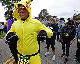 YOUNGTSOWN, OHIO - OCTOBER 21, 2018: John Black from Sharon, Pennsylvania stands at the starting line wearing a Pikachu costume , Sunday morning in Youngstown. DAVID DERMER | THE VINDICATOR