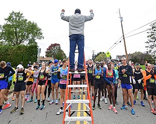 YOUNGTSOWN, OHIO - OCTOBER 21, 2018: Al George, The president of the Peace Race gives a pep talk to the races at the starting line before the start of the Peace Race, Sunday morning in Youngstown. DAVID DERMER | THE VINDICATOR