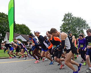 YOUNGTSOWN, OHIO - OCTOBER 21, 2018: Runners take off at the starting line at the start of the Peace Race, Sunday morning in Youngstown. DAVID DERMER | THE VINDICATOR
