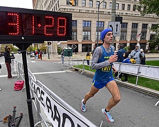 YOUNGTSOWN, OHIO - OCTOBER 21, 2018: Andrew Higgins crosses the finish line to complete the 2018 Peace Race, Sunday morning in Youngstown. DAVID DERMER | THE VINDICATOR