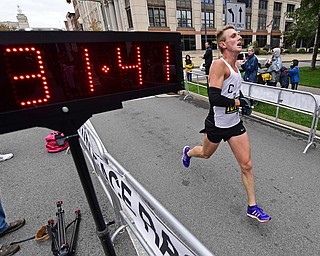 YOUNGTSOWN, OHIO - OCTOBER 21, 2018: Craig Rupe crosses the finish line to complete the 2018 Peace Race, Sunday morning in Youngstown. DAVID DERMER | THE VINDICATOR
