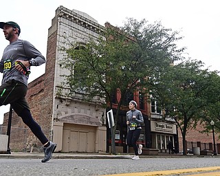 YOUNGTSOWN, OHIO - OCTOBER 21, 2018: Jonathan Conrad runs down West Federal Street on his way to the finish line, Sunday morning in Youngstown. DAVID DERMER | THE VINDICATOR