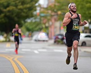 YOUNGTSOWN, OHIO - OCTOBER 21, 2018: Zach Henry runs down West Federal Street on his way to the finish line, Sunday morning in Youngstown. DAVID DERMER | THE VINDICATOR