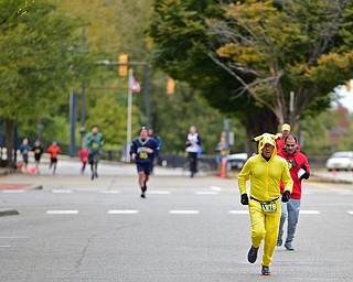YOUNGTSOWN, OHIO - OCTOBER 21, 2018: John Black from Sharon, Pennsylvania runs down West Federal Street on his way to the finish line, Sunday morning in Youngstown. DAVID DERMER | THE VINDICATOR