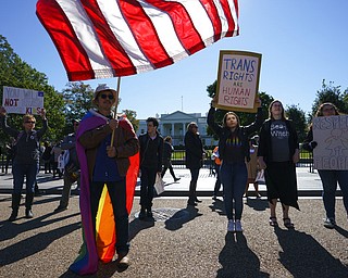 The National Center for Transgender Equality, NCTE, and the Human Rights Campaign gather on Pennsylvania Avenue in front of the White House in Washington on Monday for a #WontBeErased rally.