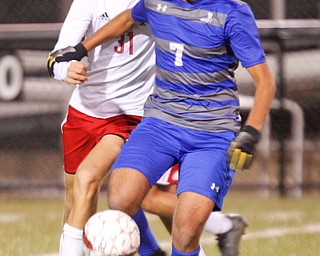 Hubbard's Nader Kassem, 7, tries to keep the ball away from Canfield's Zack Ahmed during their game at Hubbard on Tuesday night. EMILY MATTHEWS | THE VINDICATOR