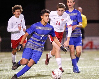 Hubbard's Nader Kassem, 7, gets ready to kick the ball down the field to try to keep it from Canfield during their game at Hubbard on Tuesday night. EMILY MATTHEWS | THE VINDICATOR