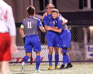 From left, Hubbard's Michael VanSuch, AJ Trobek, and Anthony Gagliardi celebrate after Gagliardi scores a goal against Canfield during their game at Hubbard on Tuesday night. EMILY MATTHEWS | THE VINDICATOR