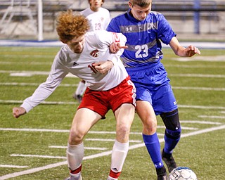 Canfield's Hunter Hale tries to get the ball away from Hubbard's Anthony Gagliardi during their game at Hubbard on Tuesday night. EMILY MATTHEWS | THE VINDICATOR