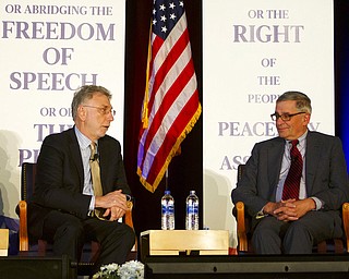 Martin Baron, left, executive editor of The Washington Post, speaks as David Shribman, executive editor of Pittsburgh Post-Gazette, listens at the National First Amendment Conference in Pittsburgh on Monday. Journalists, scholars and government officials past and present  gathered in Pittsburgh to emphasize the First Amendment's continuing importance in American society.