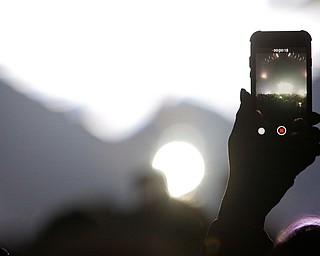 A fan in the audience take a video of Keith Urban performing with their cell phone at Covelli Centre on Wednesday night. EMILY MATTHEWS | THE VINDICATOR