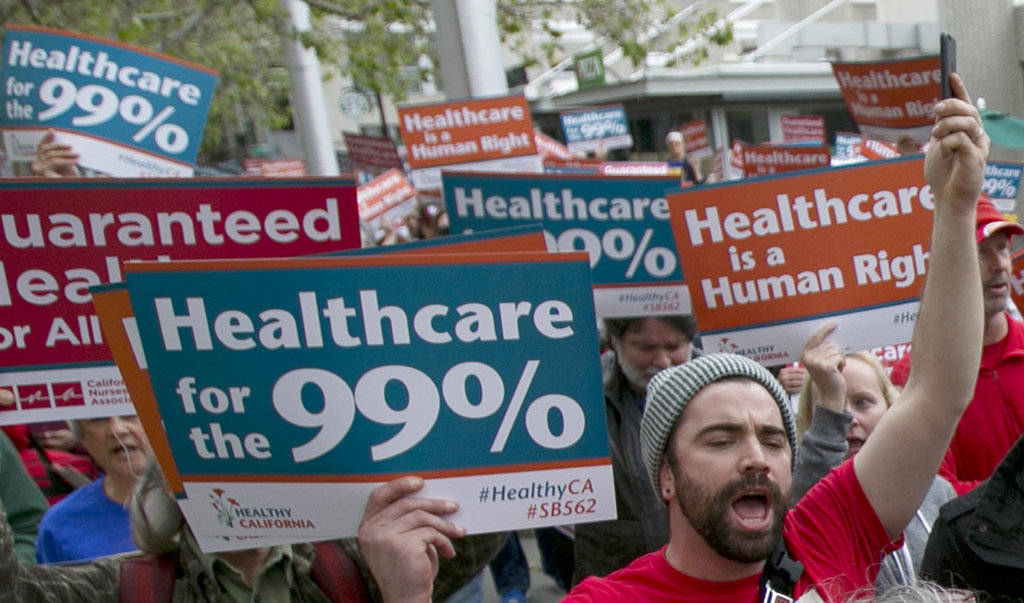 In the April 26, 2017, file photo, supporters of single-payer health care march to the Capitol in Sacramento, Calif. Large majorities of young Americans want to see an expansion of government services, including a single-payer health care program, according to a new poll by The Associated Press-NORC Center for Public Affairs Research and MTV.