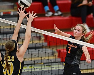 SALEM, OHIO - OCTOBER 24, 2018: Springfield's Carly Stitzel hits the ball over Crestview's Molly Emch during their OHSAA Division III Tournament volleyball match, Wednesday night at Salem High School. DAVID DERMER | THE VINDICATOR