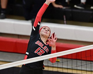 SALEM, OHIO - OCTOBER 24, 2018: Salem's Mackenzie Jeric hits the ball during their OHSAA Division III Tournament volleyball match, Wednesday night at Salem High School. DAVID DERMER | THE VINDICATOR