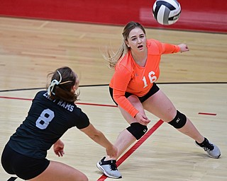 SALEM, OHIO - OCTOBER 24, 2018: Mineral Ridge's Madison Carl (16) and Katelyn Lesko watch as the ball falls between them for the Salem point during their OHSAA Division III Tournament volleyball match, Wednesday night at Salem High School. DAVID DERMER | THE VINDICATOR