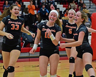 SALEM, OHIO - OCTOBER 24, 2018: Springfield's Ellie Centofanti (10) Lyndsey Smith, left, Rachel Babinec (6) and Jennie Stitzel (5) celebrate after defeating Crestview 3-2 during their OHSAA Division III Tournament volleyball match, Wednesday night at Salem High School. DAVID DERMER | THE VINDICATOR