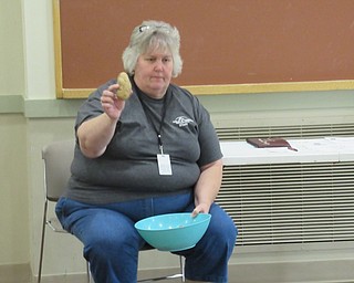 Neighbors | Jessica Harker.Brenda Markley, a naturalist at Metro Parks Farms, showed children the differences between types of potatos Sept. 25.