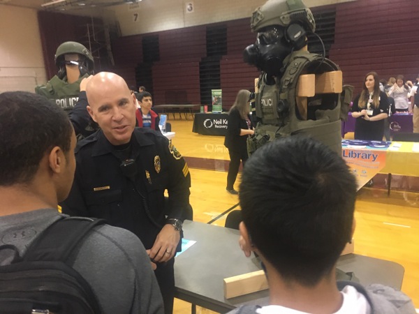 Neighbors | Submitted.Boardman SRO supervisor Sgt. Mike Sweeney explained police protective gear to students gathered at Boardmans annual Yes Fest event on Oct. 19.