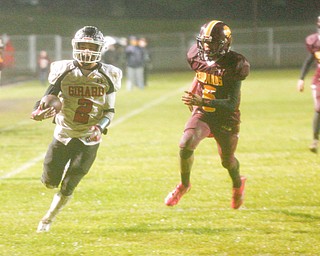 Girard's Morgan Clardy gets past Liberty as he runs with the ball to score a touchdown during the first half of their game at Liberty on Friday night. EMILY MATTHEWS | THE VINDICATOR