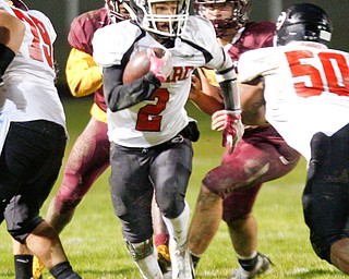 Girard's Morgan Clardy tries to get past Liberty as he runs with the ball during the first half of their game at Liberty on Friday night. EMILY MATTHEWS | THE VINDICATOR