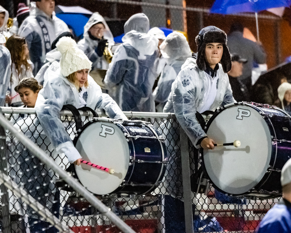 DIANNA OATRIDGE | THE VINDICATOR  Poland bass drummers play a cadence during the Battle of 224 between Poland and Canfield at Bob Dove Field in Canfield on Friday.