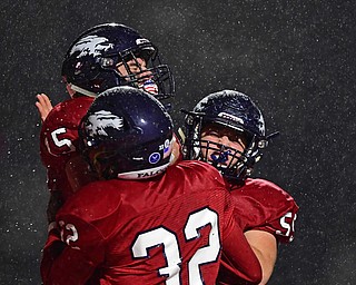 AUSTINTOWN, OHIO - OCTOBER 26, 2018: Fitch's Domenic Montalbano is congratulated by Rod'dell Bebbs (32) and Justin Stainfield after scoring a touchdown during the first half of their game, Friday night at Austintown Fitch High School. DAVID DERMER | THE VINDICATOR