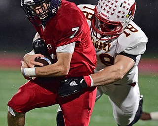 AUSTINTOWN, OHIO - OCTOBER 26, 2018: Fitch's Bobby Cavalier is tackled by Mooney's Luke Fulton during the first half of their game, Friday night at Austintown Fitch High School. DAVID DERMER | THE VINDICATOR