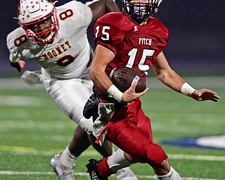 AUSTINTOWN, OHIO - OCTOBER 26, 2018: Fitch's Domenic Montalbano runs away from Mooney's Cheriff Jamison during the first half of their game, Friday night at Austintown Fitch High School. DAVID DERMER | THE VINDICATOR
