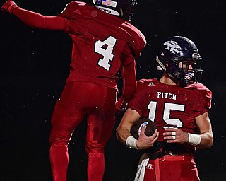 AUSTINTOWN, OHIO - OCTOBER 26, 2018: Fitch's Domenic Montalbano celebrates with Corey Vernon after scoring a touchdown during the first half of their game, Friday night at Austintown Fitch High School. DAVID DERMER | THE VINDICATOR