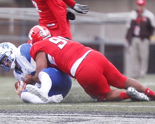 Indiana State's Ryan Boyle gets tackled by YSU's Wesley Thompson during their game at Stambaugh Stadium on Saturday. EMILY MATTHEWS | THE VINDICATOR