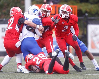 Indiana State's Joe Wildt gets tackled by, from left, YSU's Armand Dellovade, Melvin Jackson, Devanere Crenshaw, and DJ Smalls (29) during their game at Stambaugh Stadium on Saturday. EMILY MATTHEWS | THE VINDICATOR