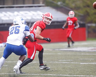 YSU's Ryan Emans watches the ball go past him with Indiana State's Jamal Jones close behind him during their game at Stambaugh Stadium on Saturday. EMILY MATTHEWS | THE VINDICATOR