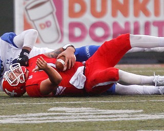 YSU's Nathan Mays gets tackled by Indiana State's Pishon Powell during their game at Stambaugh Stadium on Saturday. EMILY MATTHEWS | THE VINDICATOR