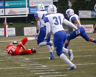 Indiana State runs towards the ball after YSU's Nathan Mays drops it during their game at Stambaugh Stadium on Saturday. EMILY MATTHEWS | THE VINDICATOR