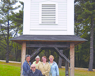 The Harding Park Meeting House Building Committee in Hubbard has been working for years to raise enough money to construct a multipurpose facility in Harding Park, featuring artifacts and materials that were salvaged from a historic church. Thanks to the committee, the restored church bell tower stands near the entrance of Harding Park. Pictured are Joe Jendrasiak, seated, and Mary Buchenic, left, Judy Ruby, Linda Clark and Joanne Cutter.