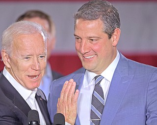 Former Vice President Joe Biden, left, embraces U.S. Rep. Tim Ryan of Howland, D-13th, during a rally Monday at Youngstown State University to support Richard Cordray, the Democratic candidate for Ohio governor.
