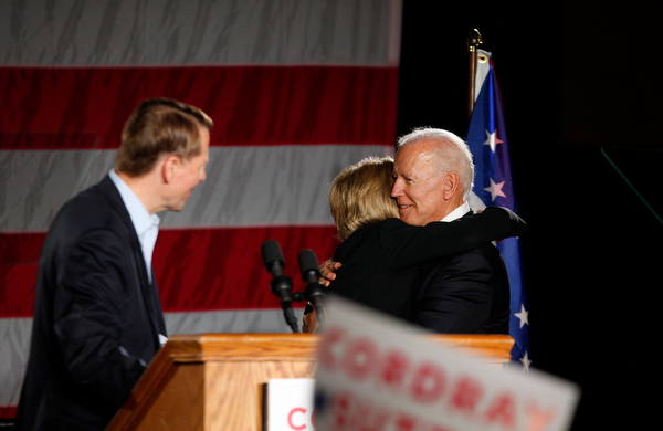 Former U.S. Vice President Joe Biden hugs Richard Cordray's running mate Betty Sutton while Cordray stands at the podium Monday afternoon at Youngstown State University. EMILY MATTHEWS | THE VINDICATOR